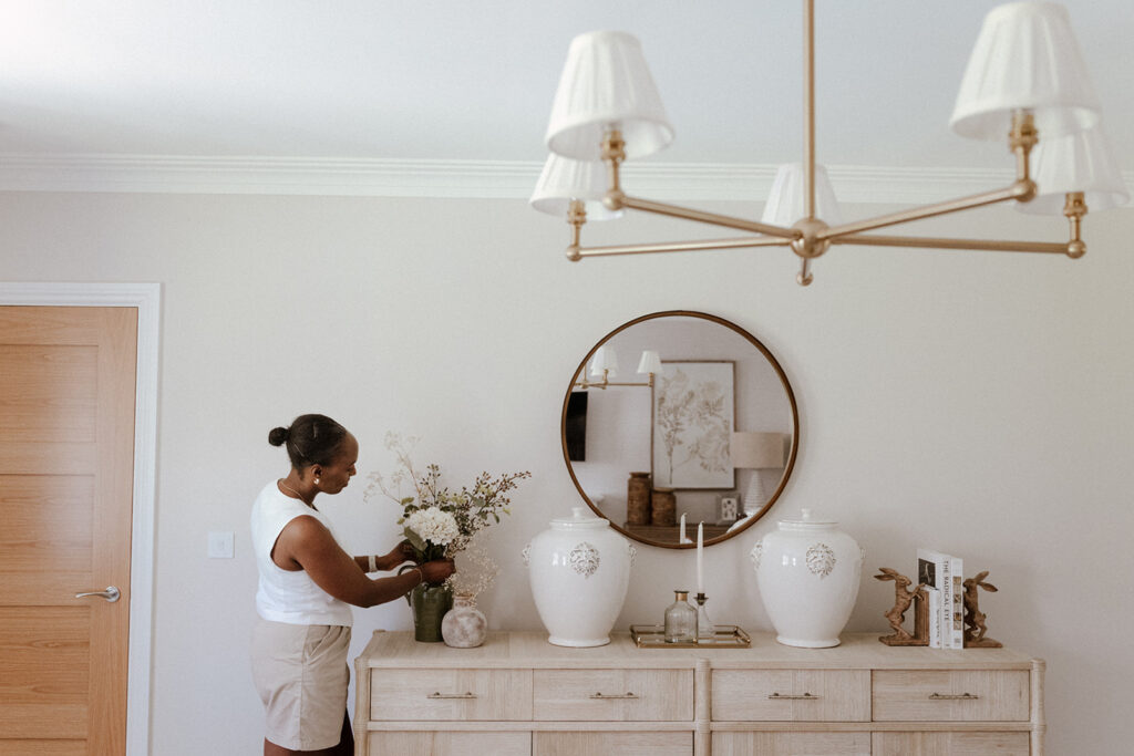 one of the JTI design team staging a room