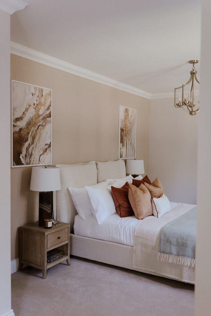 cosy bedroom design with neutral tones and layers created by an expert interior designer